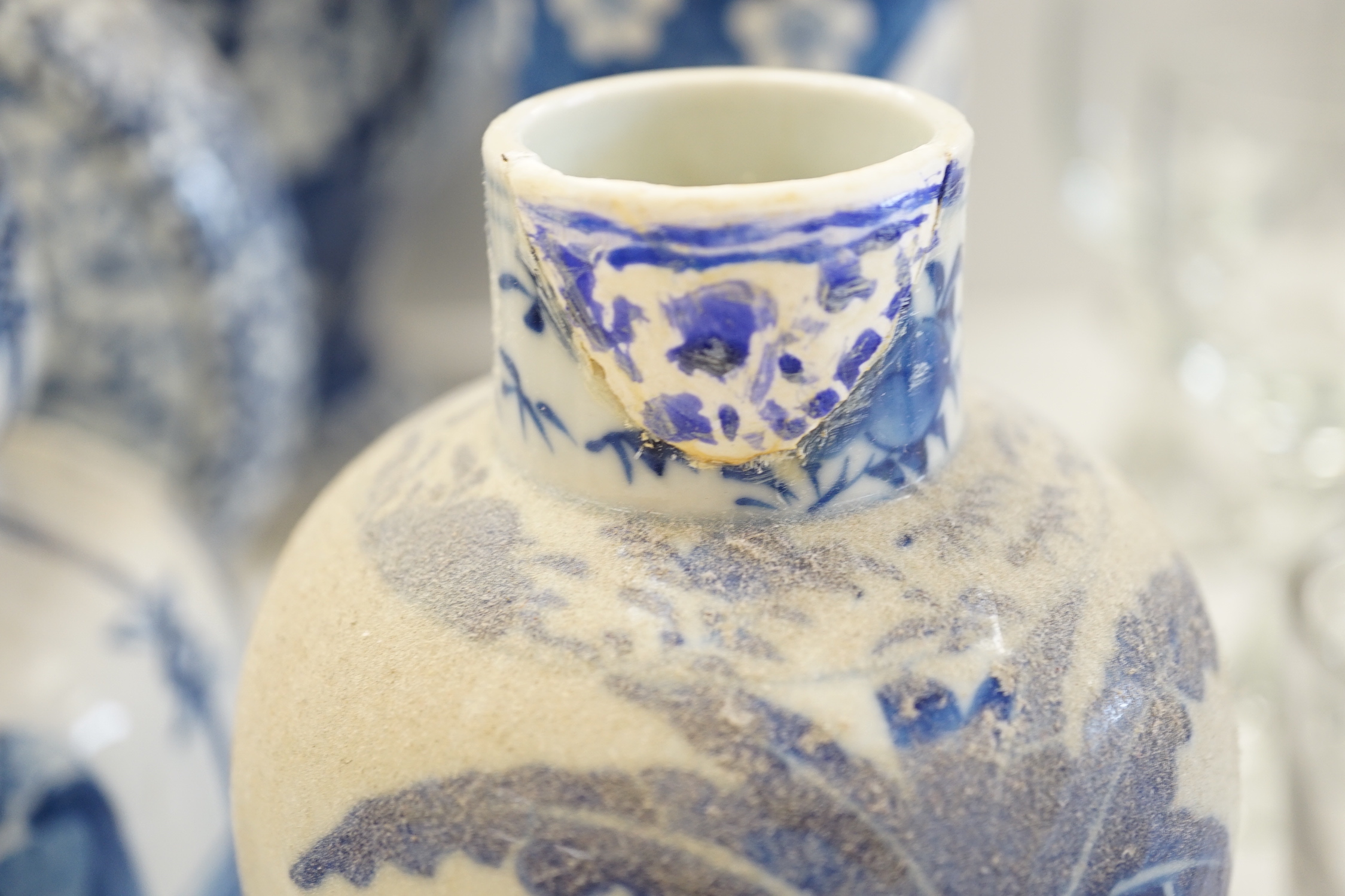 A Chinese blue and white Buddhist lion moon flask, a baluster vase, three sleeve vases and two others, 19th century, tallest 33cms (a.f.)